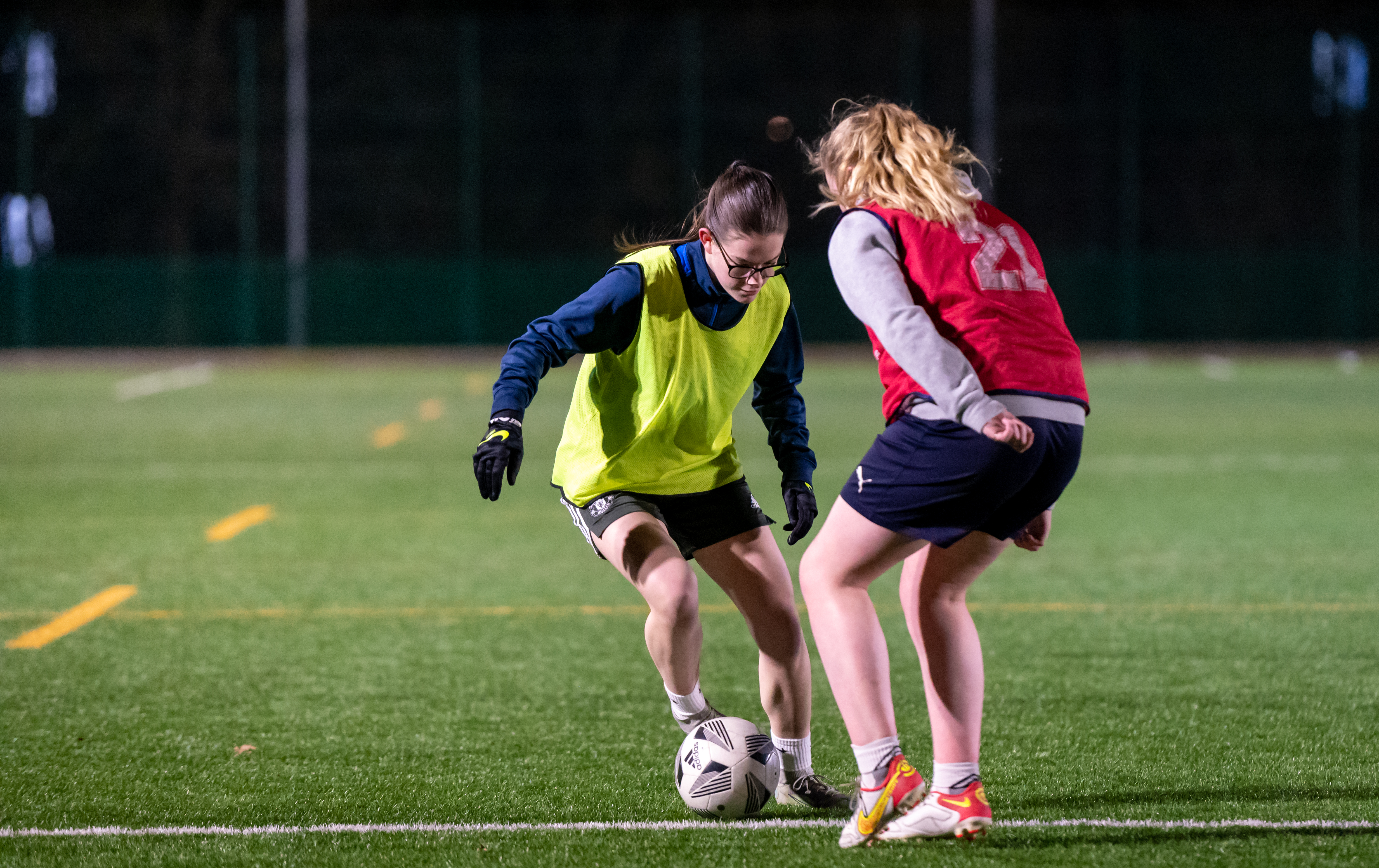 two women playing football